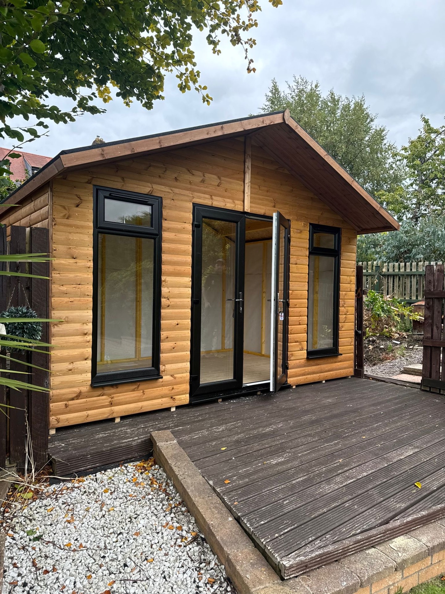 Timber summer house with French doors and decking, built in Ayrshire