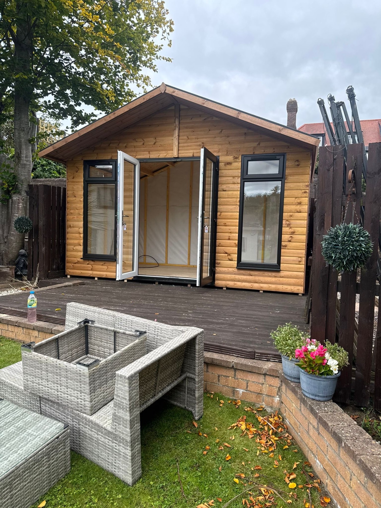 Timber garden room with double French doors and windows