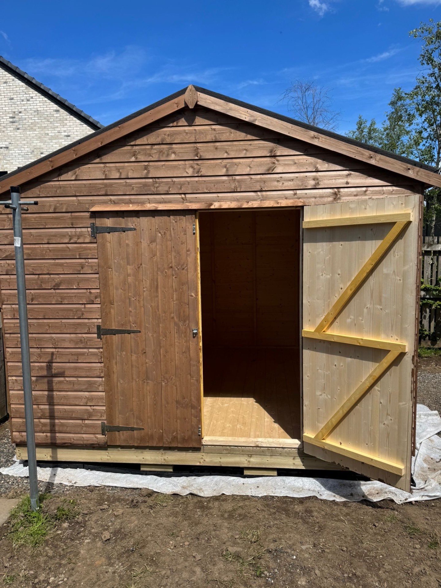Timber workshop with double braced doors open